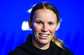 In Pictures: Caroline Wozniacki gushes over her "little helper" as husband  David Lee lifts up daughter Olivia to help decorate Christmas tree