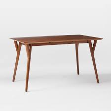 With a solid wood frame for lasting use, this dining table features an open base and a rectangular top that's perfect for hosting everything from dinner. Mid Century Expandable Dining Table Walnut West Elm United Kingdom