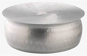 This contemporary coffee table boasts a hammered aluminum finish that allows light to bounce off the textured surface. Hammered Coffee Table Buy Online In United Arab Emirates At Desertcart Ae Productid 54645675