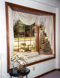Bay windows are a bit odd and this means they sometimes pose problems. Slightly Raised Bay Window Bench Seat W Credenza In Front Never Mind The Ridiculous C Bay Window Bay Window Curtains Living Room Window Curtains Living Room