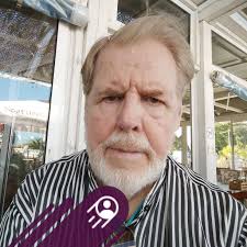 Which island in Thailand is ideal to visit in August for a budget beach  trip?