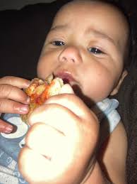 He is killing his Franks Pizza 🍕 not a tooth in the world but he knows at  an early age what he likes