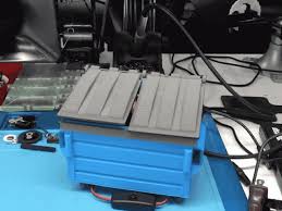 Design ideas for a modern living room in other with beige walls, medium hardwood flooring, a wood burning stove, a metal fireplace surround, a freestanding tv and brown floors. 3d Printing Desktop Dumpster Fire Adafruit Learning System