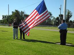Weldon family receives flag from Brilliant Legion for business