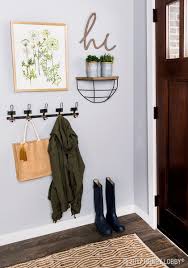 Add Emphasis To Your Entryway With A Simple Chic Gallery Wall Entryway Decor Small Entryway Wall Decor Home Decor Accessories