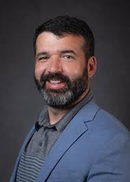 Adam Hampton, Principal