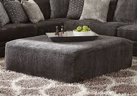 Choosing an ottoman versus a coffee table depends on the size of your living space. Mammoth Smoke Oversized Ottoman Cincinnati Overstock Warehouse