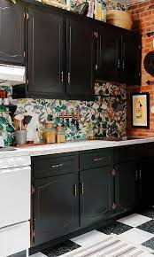 Wallpaper both your backsplash and walls if you aren't afraid to go bold. Simple 5 Minute Projects Are The Secret To This Small Kitchen S Success Kitchen Remodel Small Kitchen Cabinet Design Wallpaper Backsplash Kitchen