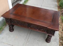 Old world table chai coffee table, rustic tones hand crafted door, flat top, carved sides accent vintage tables. Renaissance Architectural Spanish Coffee Tables Italian Coffee Tables French Coffee Tables