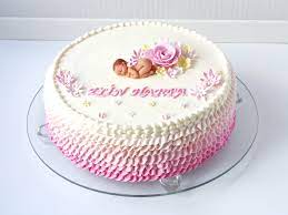 Frills In White And Different Shades Of Pink Made From Frosting Decorating A Cake Topped With Baby Shower Cakes Girl Baby Shower Cakes For Boys Shower Cakes