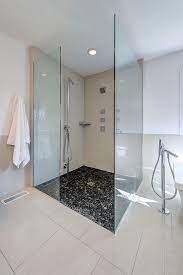 We love this bathroom from charlie interior design that features a tiled floor and wall with gray and white tiles that are just different enough to create delineation. Shower Floor Ideas That Reveal The Best Materials For The Job