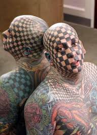 Gang members turn their lives around by removing their gang tattoos. Tattooed Face Page 1