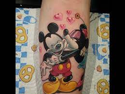 Nice black deathly hallows tattoo on back right shoulder. Mickey Minnie Mouse Tattoo Youtube