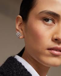 Sparkly, elegant, stylish: Shop the Givenchy crystal embellished stitch  clip earrings. #CETTIRE #Givenchy