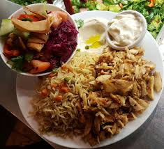 Learn how to make delicious shawarma rice platter in street food style at home a complete step by step method of making tasty chicken shawarma rice. Chicken Shawarma Plate Hummus Rice Garlic Sauce And Fattoush Salad Middle Eastern Dishes Mediterranean Cuisine Restaurant Food Delivery