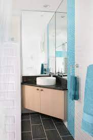 This is a contemporary style bathroom with wooden cabinets and glossy deco countertops in white. Corner Bathroom Sink Ideas Houzz