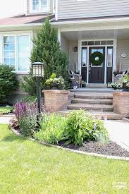 A landscape with rocks is very decorative and popular with many gardeners. How To Camouflage A Lamp Post In The Front Yard See The Plants And Flowers That Will Help Blend A La Light Post Landscaping House Landscape Outdoor Lamp Posts