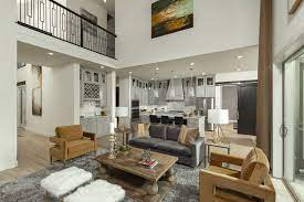 A Family Room With Two Story Ceilings Open To The Kitchen Home Coventry Homes Family Room