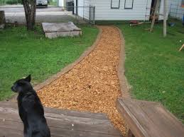 Wood Chip Path Lined With Pavers Outdoor Walkway Outdoor Gardens Cypress Mulch
