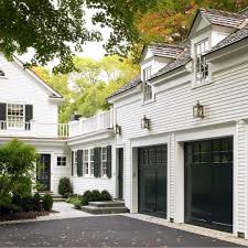 Black And White House With Wood Garage Door White Exterior Black Garages I Don T Think I Will Ever Tire Of Black And White So Timeless Also Today We Shared The Las House Exterior House New Homes