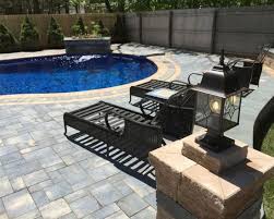 Located under a full overhang, there isn't a ton of sun to be had here. Cambridge Pavers Montauk Blue Ledgestone Pool Patio Miller Place Ny 11764 Pool Patio Patio Cambridge Pavers