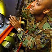 US Air Force (USAF) STAFF Sergeant (SSGT) Jason Thoel, Non-commissioned  Officer in Charge (NCOIC), Communications Focal Point, 438th Expeditionary  Supply Squadron (ESS), 438th Air Expeditionary Wing (AEW), uses a laptop  computer to