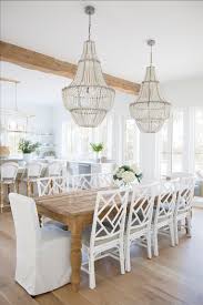 The geometric lines of the furniture and accessories help to reinforce the clean and crisp look. Dining Area Breakfast Table Dining Room Coastal Home Beach House Beach House Dining Room Coastal Dining Room House Dining Room