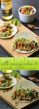 It's full of tangy, fresh flavor! Spicy Fish Tacos With Mango Salsa And Avocado Cilantro Crema The Pineapple Cake Spicy Fish Tacos Food Recipes
