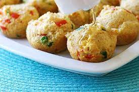 Hush puppies are made up of corn meal batter that has garlic powder, onion powder and a hint of paprika for some added spice. Baked Hushpuppies Tasty Kitchen Blog