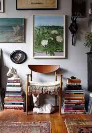 Incorporate Books Into A Small Apartment By Stacking Them In Organized Piles On Either Side Of A Reading Chair It Makes For An I Interior Interior Design Home
