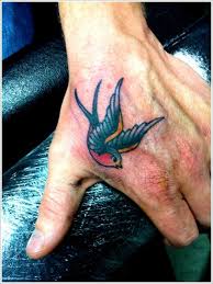 Swallow Bird Tattoo On Hand Meaning Simple Swallow Tattoo Designs Swallow Tattoo Design Swallow Tattoo Hand Tattoos