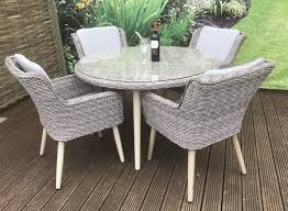 If your garden is very small, it might suit more mobile these can look sophisticated in black or earth tones, surrounding a matching table. Signature Weave Danielle 4 Chair Round Table Garden Dining Set