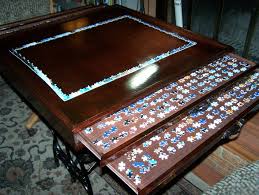 Puzzle Working Board With Storage Drawers On An Antique Sewing Machine Base Puzzle Table Antique Sewing Machines Jigsaw Puzzles