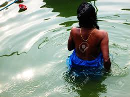Woman Taking Bath In Holy Ganga, India Stock Photo, Picture and Royalty  Free Image. Image 47849324.