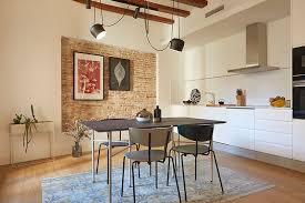 The kitchen opens to an outdoor dining area. Spanish Interior Design At Its Best Updated Apartment In Barcelona Tg Uk