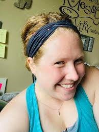 What headband can help keep a graduation cap in place?