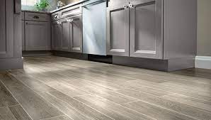 Nice and neutral painted floors a pretty soft gray paint on breakfast nook floors grounds white furnishings and walls. Tile Wood Look Flooring Ideas