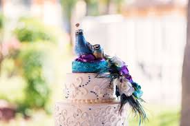 These ladies, along with a handful of other fabulous vendors, used the vibrant colors of the peacock to create a diy styled wedding, in a beautiful natural setting. Diy Colorful Peacock Themed Bridal Bouquet