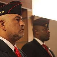 Members of the joint color guard stand by during a