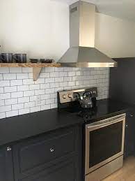 They are durable and versatile, allowing for a multitude of designs and themes. Charcoal Kitchen Cabinets With A Black Granite Top Subway Tile Back Splash With Charcoal Grout Refurbishe Granite Kitchen Black Kitchens Kitchen Redecorating