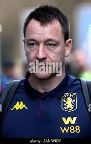 Aston Villa assistant manager John Terry (right) and Liverpool manager  Jurgen Klopp chat