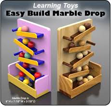 Learning Toys Marble Drop Wood Toy Plans Pdf Download Wooden Toys Diy Wood Toys Wood Projects For Kids