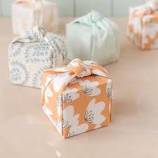 Choose a ribbon color that goes great with the gift wrap. Fabric Gift Wrap Technique Is An Eco Friendly Option For The Holidays