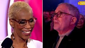 Trisha Goddard husband gazes lovingly up at her as she enters house