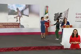 Mexico's Sheinbaum hands World Cup tickets to four young Mexican women ahead of tournament