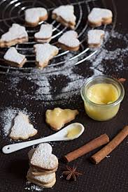 Ricotta cookies with lemon are a traditional italian christmas dessert. Christmas Cookies Filled With Lemon Curd Stockphoto
