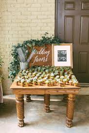 How To Use Wedding Favor Sayings To Personalize Your Wedding Favor Choices Put The Ring On It Wedding Favor Table Wedding Reception Favors Succulent Wedding Favors
