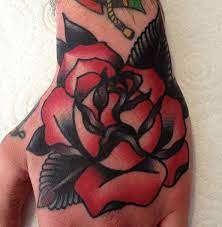 Reviewing Tattoo Designs For Hands Red Black Flower Tattoo For Hand And Wrist Cvcaz Tattoo Art Traditional Hand Tattoo Hand And Finger Tattoos Hand Tattoos