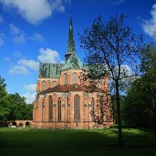 The monastery is located on a small island in which you can access by foot walking over a metal bridge. Doberan Cistercian Monastery Klosterland