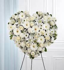 A heart shaped cushion a classic white chrysanthemum based cushion. Deeply Adored Closed Heart Creative Floral Designs